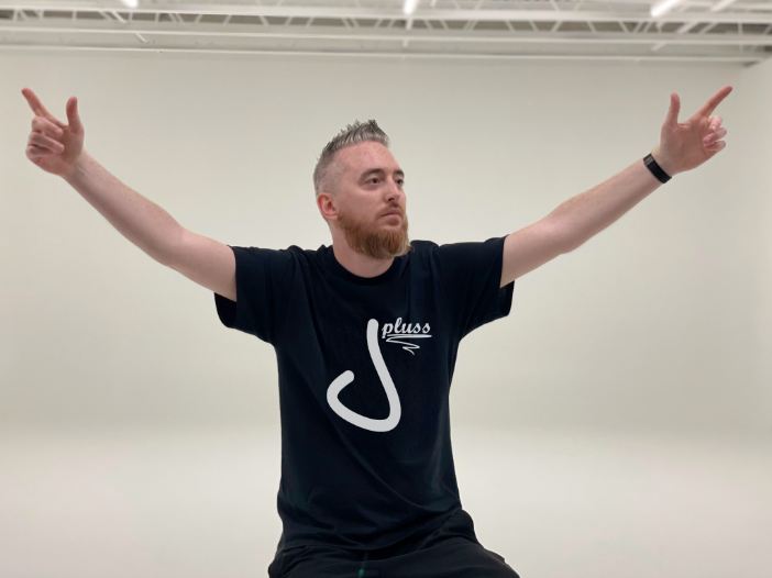 Jay Pluss wearing logo on shirt